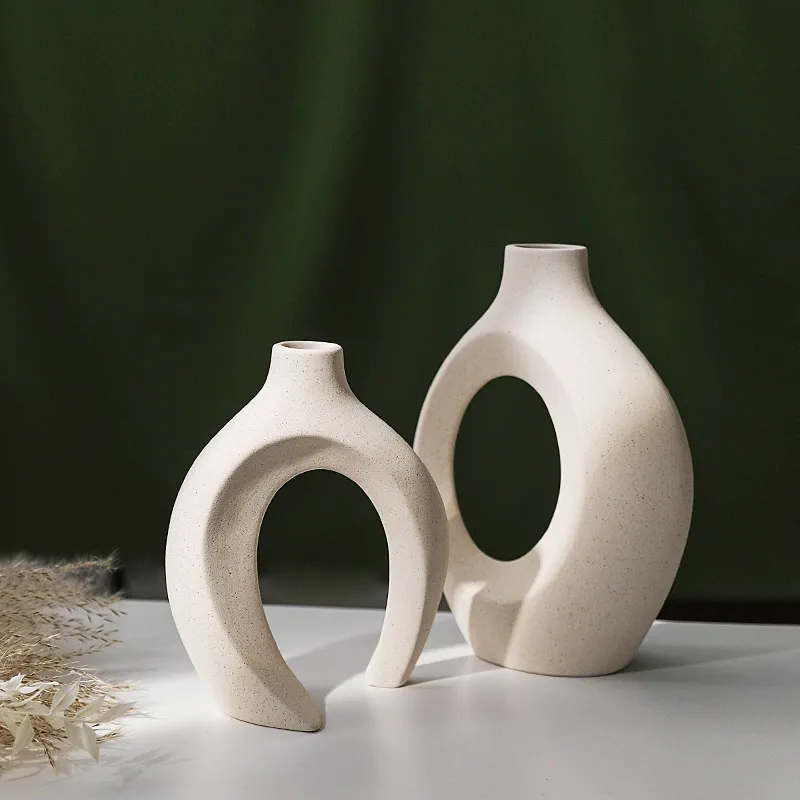 The two vases separated to show their closed and open shapes