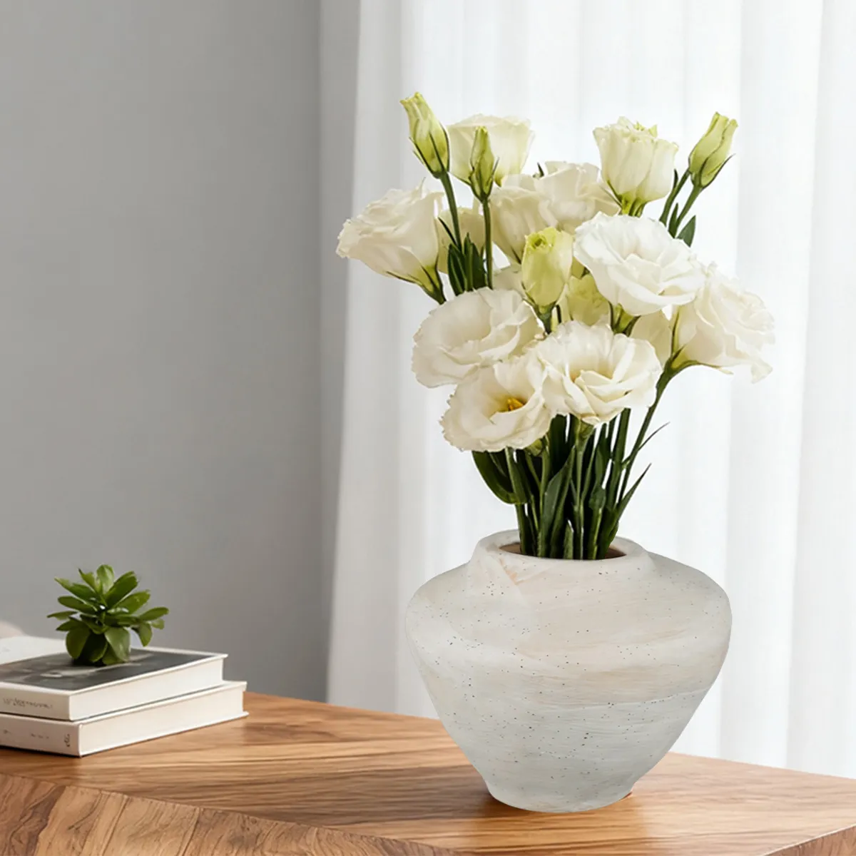 Higher view of the round vase showing its opening and softly banded finish